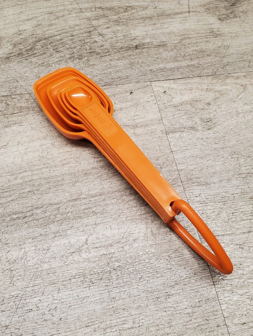 Vintage Tupperware orange measuring spoons